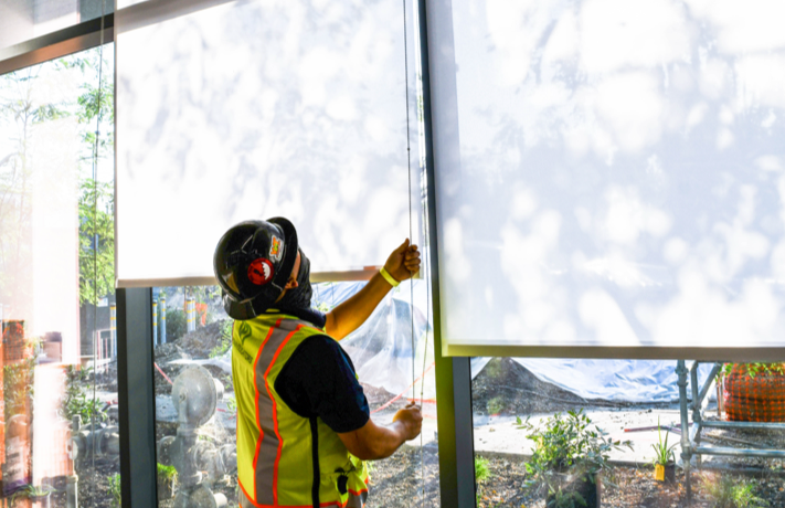 Our Promise to You-man adjusting window shade
