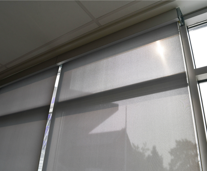 Rollershades-semisheer rollershade with light reflecting through